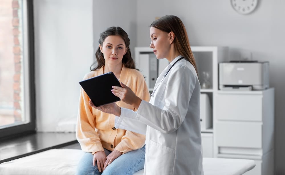 Nurse practitioner reviewing personalized results with a patient