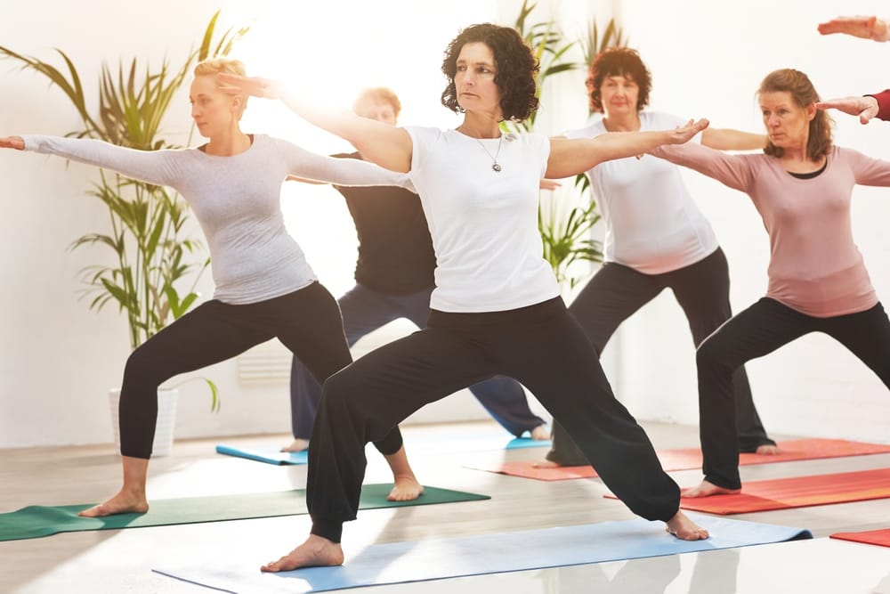 Women in a yoga class supporting metabolism and energy