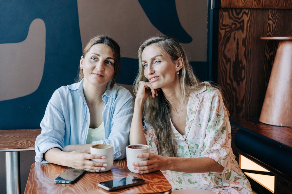 Two women in midlife enjoying coffee together