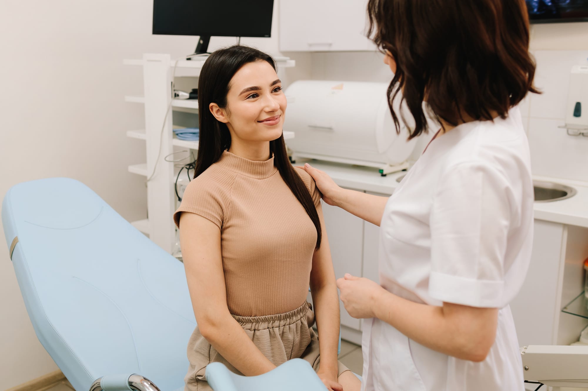 A woman meeting with her provider at Eden Wellness